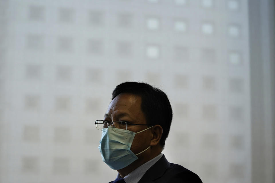 Xu Guixiang, the deputy director-general of the Xinjiang Communist Party publicity department, speaks during an interview in Beijing on Monday, Dec. 21, 2020. The Chinese Communist Party official signaled Monday that there would likely be no let-up in its crackdown in the Xinjiang region, but said the government's focus is shifting more to addressing the roots of extremism. (AP Photo/Ng Han Guan)