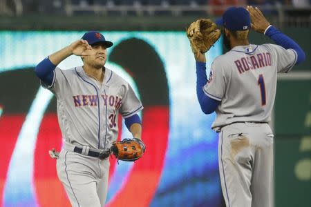 Sep 23, 2018; Washington, DC, USA; New York Mets left fielder Michael Conforto (30) celebrates with Mets shortstop Amed Rosario (1) after defeating the Washington Nationals at Nationals Park. Mandatory Credit: Amber Searls-USA TODAY Sports