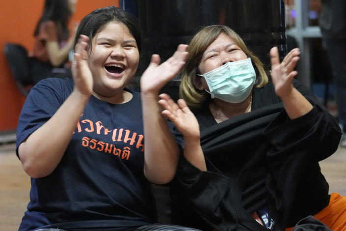 Supporters of Move Forward party cheer as they watch the counting of votes on television at Move Forward Party headquarters in Bangkok, Thailand, Sunday, May 14, 2023. Vote counting was underway Sunday in Thailand's general election, touted as a pivotal chance for change nine years after incumbent Prime Minister Prayuth Chan-ocha first came to power in a 2014 coup. (AP Photo/Sakchai Lalit)