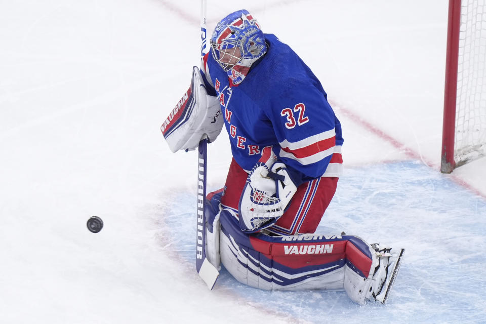 New York Rangers goaltender Jonathan Quick deflects a Boston Bruins goal-attempt in the first period of an NHL hockey game, Thursday, March 21, 2024, in Boston. (AP Photo/Steven Senne)