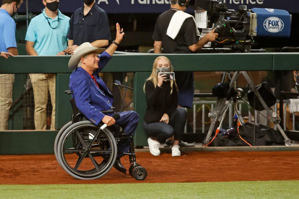 Greg Abbott on the field before Game 1 of the 2020 World Series.