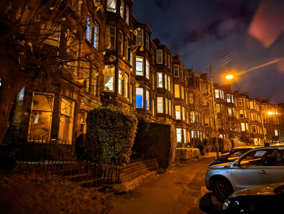 View of Glasgow at night, street with lit up buildings