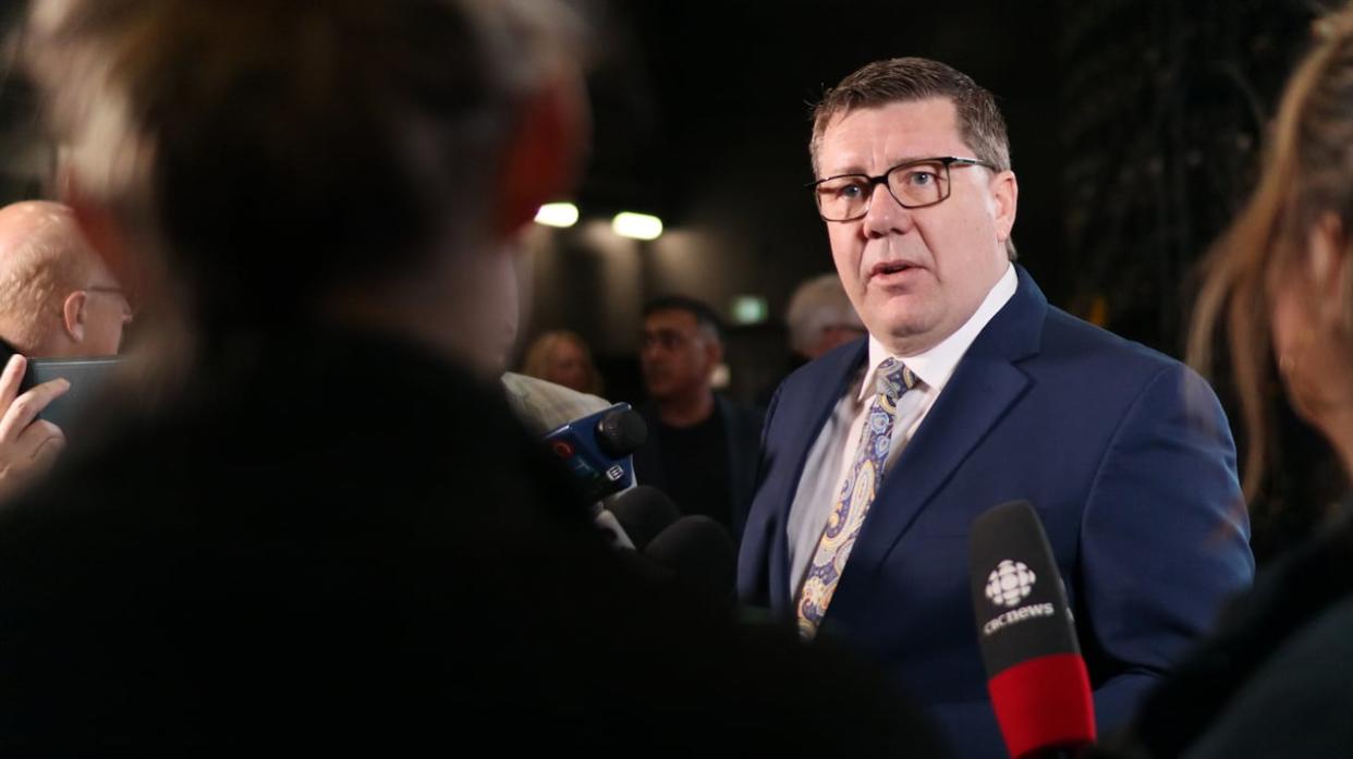 Saskatchewan Premier Scott Moe says halting sexual health education presentations in school by third parties and providing funding meant to address intimate partner violence to those same organizations are separate issues.  (CBC / Radio-Canada - image credit)