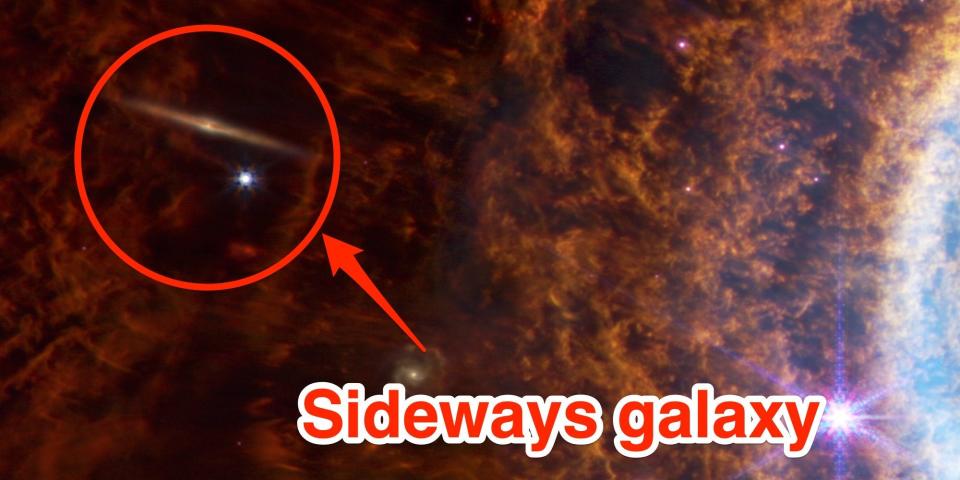 A Galaxy caught on the outskirts of the Southern ring nebula is shown here.