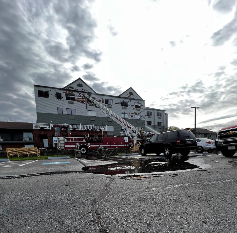 The effort to extinguish a fire at the Wayfinder Hotel continued Tuesday morning with Newport Fire Department crews concentrating on hot spots.