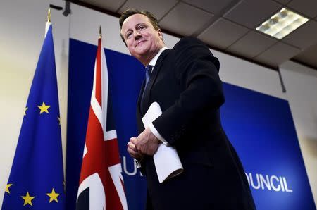 British Prime Minister David Cameron smiles as he leaves a European Union leaders summit in Brussels, Belgium, February 19, 2016. REUTERS/Dylan Martinez