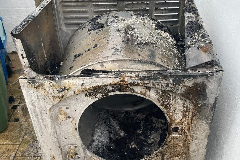 Damage caused to a tumble dryer after it went on fire in Mynythno, Gwynedd