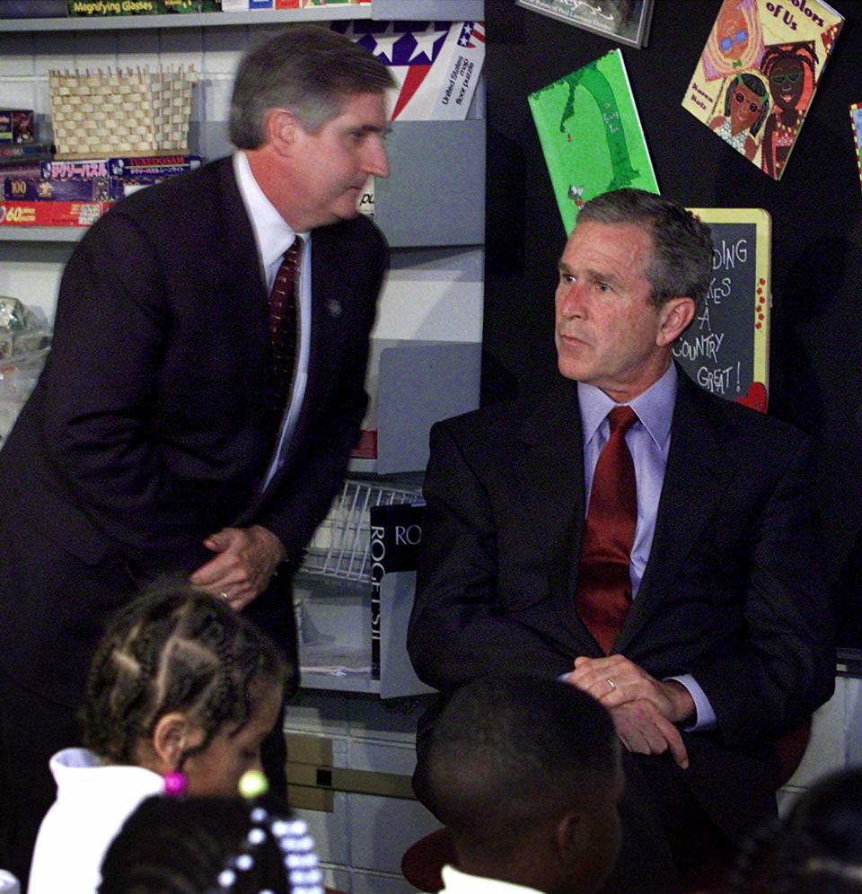 A stunned President George W. Bush looks past his chief of staff, Andrew Card, after learning about the planes crashing into the World Trade Center on September 11, 2001. / Credit: DOUG MILLS / AP