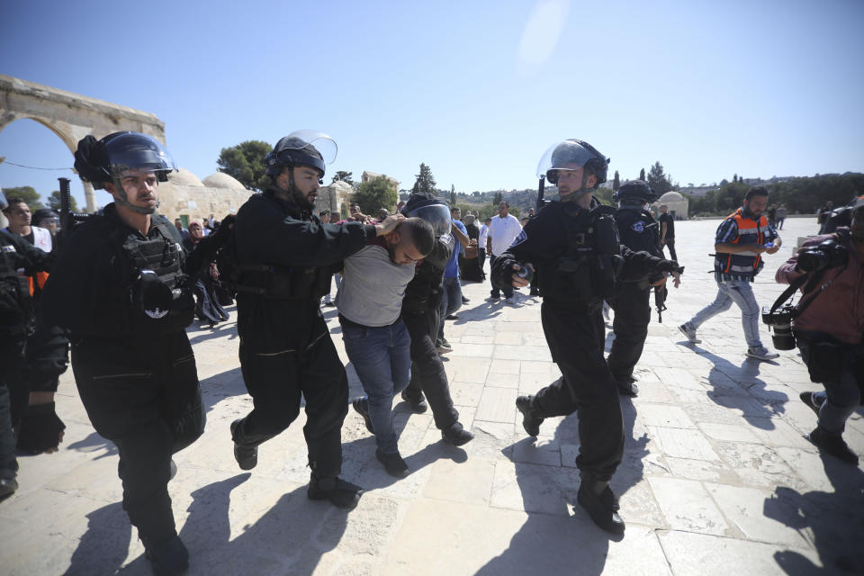 Israeli police arrests a Palestinian worshipper at al-Aqsa mosque compound in Jerusalem, Sunday, Aug 11, 2019.(AP Photo/Mahmoud Illean)