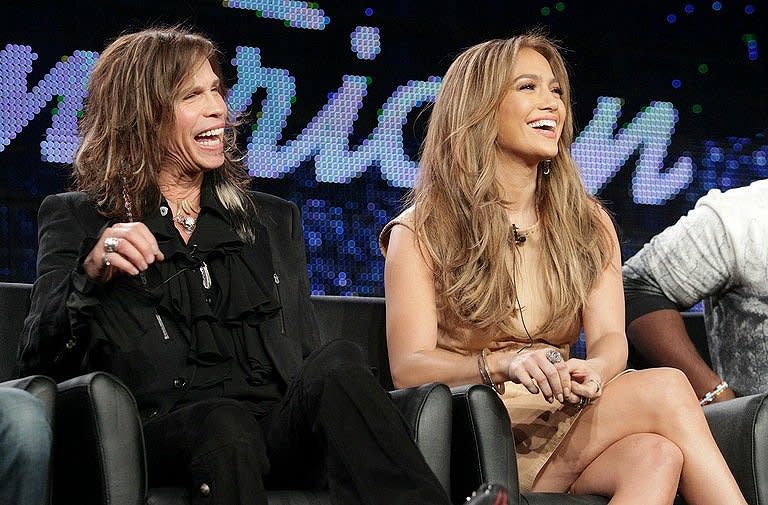 Musicians Steven Tyler (L) and Jennifer Lopez speak onstage during the 'American Idol' at the Langham Hotel in Pasadena, California, in January 2011. Lopez will split with her musician and actor husband, Marc Anthony, after seven years of marriage, the couple revealed to People magazine in a joint statement Friday