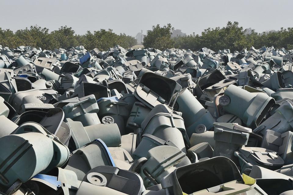 In a cruel irony, Visalia split recycle cans were destined for the county landfill. Roughly 30,000 cans await their fate in a 5-acre lot beside the city's wastewater treatment plant on Oct. 30, 2019.