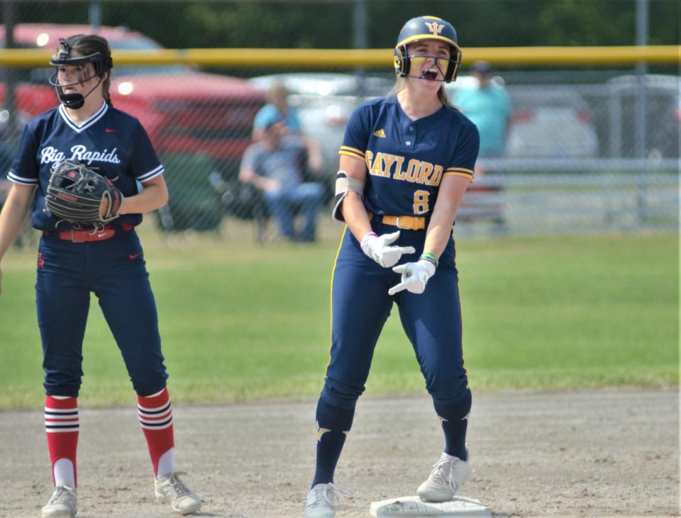 Alexis Kozlowski celebrates a double during an MHSAA regional softball matchup between Gaylord and Big Rapids on Saturday, June 10 in Cadillac, Mich.