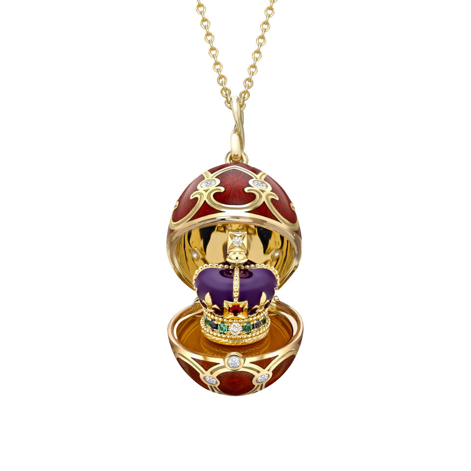 Fabergé has created two 18-karat yellow gold egg lockets to mark the coronation. They are hand-painted with a red guilloché enamel, and decorated with 17 round brilliant-cut white diamonds. Each one contains a surprise that is revealed at the touch of a diamond button.