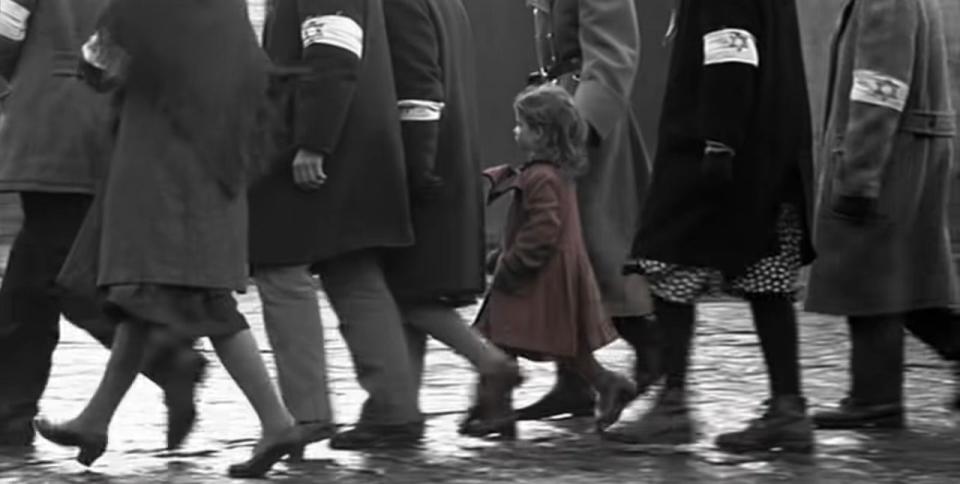 The girl in the red dress walking with a crowd of Jews in "Schindler's List"