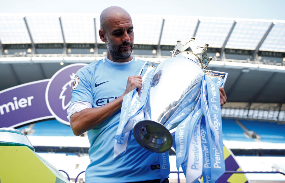 <p>Soccer Football – Premier League – Manchester City vs Huddersfield Town – Etihad Stadium, Manchester, Britain – May 6, 2018 Manchester City manager Pep Guardiola celebrates with the trophy after winning the Premier League title Action Images via Reuters/Carl Recine EDITORIAL USE ONLY. No use with unauthorized audio, video, data, fixture lists, club/league logos or “live” services. Online in-match use limited to 75 images, no video emulation. No use in betting, games or single club/league/player publications. Please contact your account representative for further details. </p>