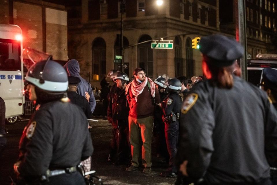 Members of the NYPD detain protesters at Columbia. Getty Images