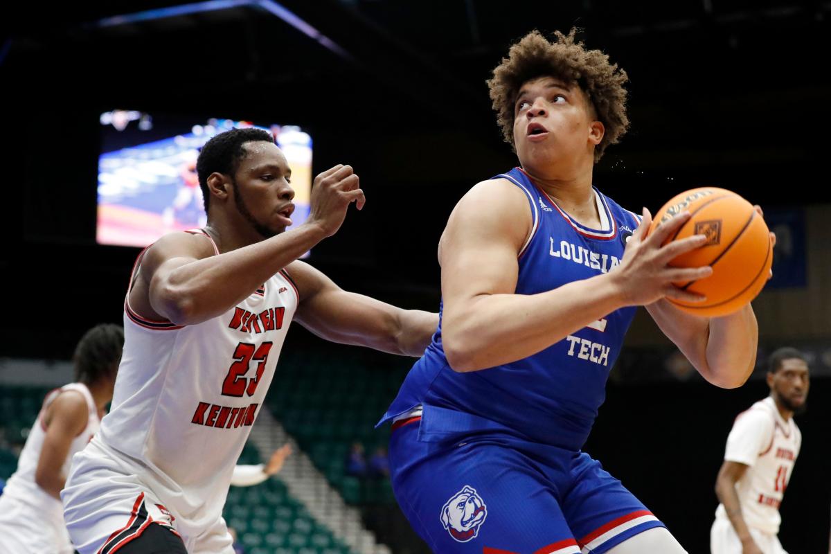 Louisiana Tech forwards Kenneth Lofton, Jr. (2) and Andrew Gordon (33)  celebrate a win over Mississippi after an NCAA college basketball game in  the NIT, Friday, March 19, 2021, in Frisco, Texas. (