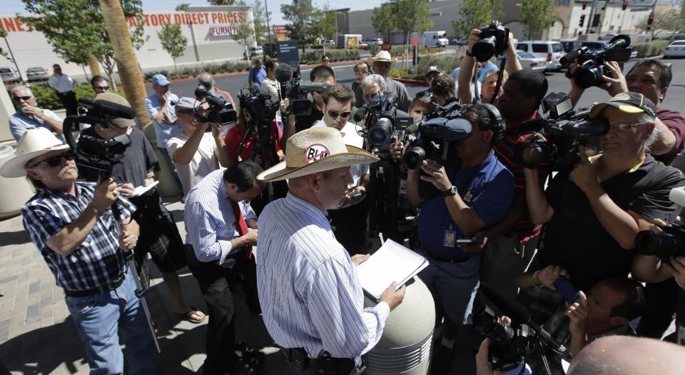 Ammon Bundy, son of rancher Cliven Bundy talks to the media about a criminal complaint he is going to file against the Bureau of Land Management at Metropolitan Police Department headquarters Friday, May 2, 2014 in Las Vegas. Last month, federal agents launched a cattle roundup on the Bundy ranch after they refused a court order to remove their cattle from public land and pay a grazing fee. (AP Photo/Chris Carlson)