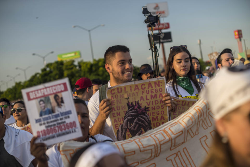 People attend a march coined "Culiacan Valiente," or Brave Culiacan, to protest violence and demand safety in Culiacan, Mexico, Sunday, Oct. 27, 2019. Residents are still coming to grips with the worst cartel violence in recent memory, in which 13 people were killed including at least three innocents caught in the crossfire, on Oct. 17, a date now known as “black Thursday.” (AP Photo/Augusto Zurita)