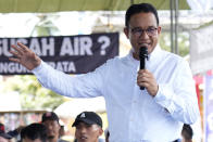 HPresidential candidate Anies Baswedan gestures as he speaks during his campaign rally in Lampung Timur, Indonesia, Sunday, Jan. 14, 2024. The former Jakarta governor seeking Indonesia's presidency said democracy is declining in the country and pledged to make changes to get it back on track. (AP Photo/Achmad Ibrahim)