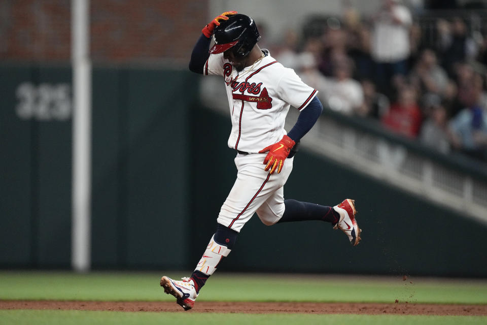 Atlanta Braves' Ozzie Albies rounds the bases after hitting a home run in the sixth inning of a baseball game against the Miami Marlins, April 25, 2023, in Atlanta. Albies hit two home runs in the game. (AP Photo/John Bazemore)