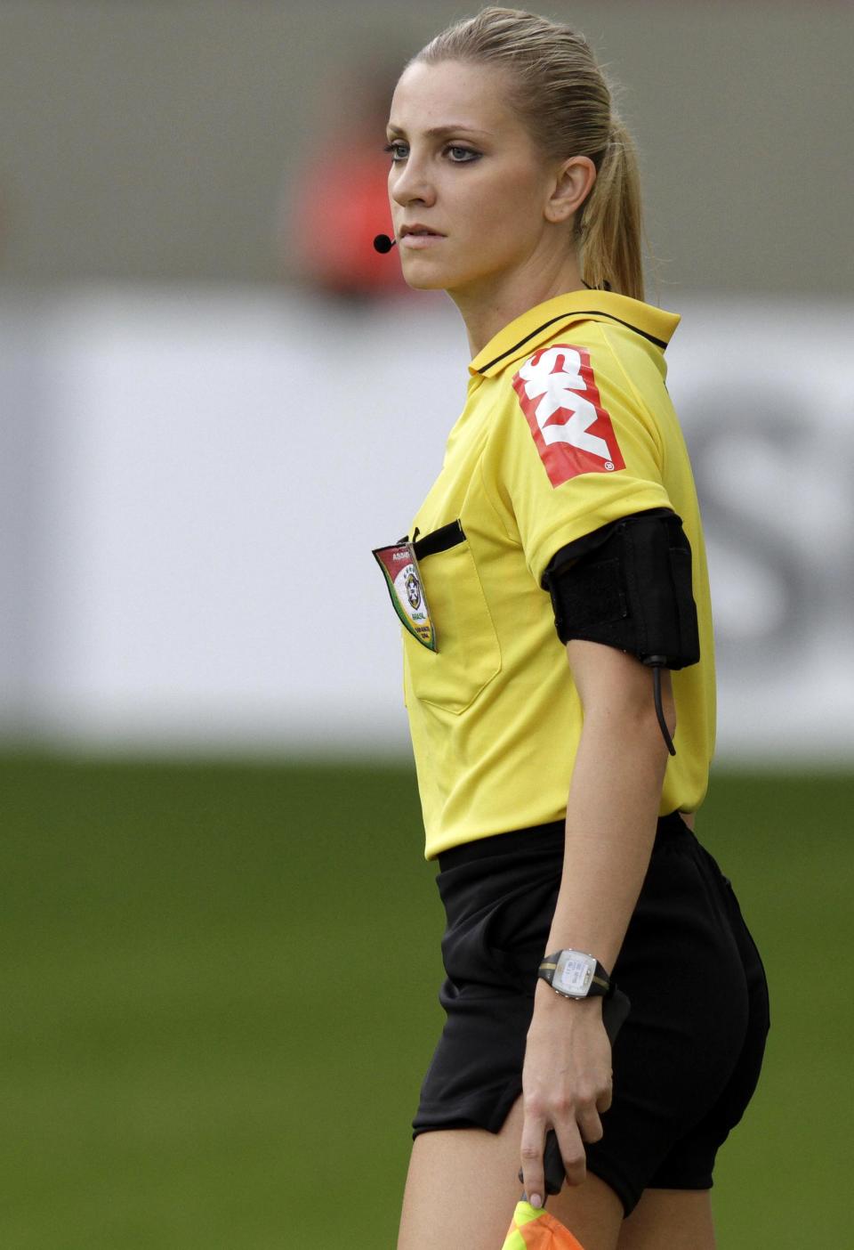 Brazil's referee assistant Fernanda Colombo Uliana runs during the Brazilian championship soccer match between Atletico Mineiro and Cruzeiro in Belo Horizonte May 11, 2014. Uliana has just been granted FIFA official status by the refereeing committee of the Brazilian Football Confederation. REUTERS/Washington Alves (BRAZIL - Tags: SPORT SOCCER)