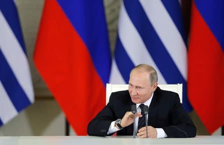 Russian President Vladimir Putin speaks after signing a bilateral agreement with his Uruguayan counterpart Tabare Vazquez during a meeting in Moscow, Russia February 16, 2017. REUTERS/Yuri Kochetkov/Pool