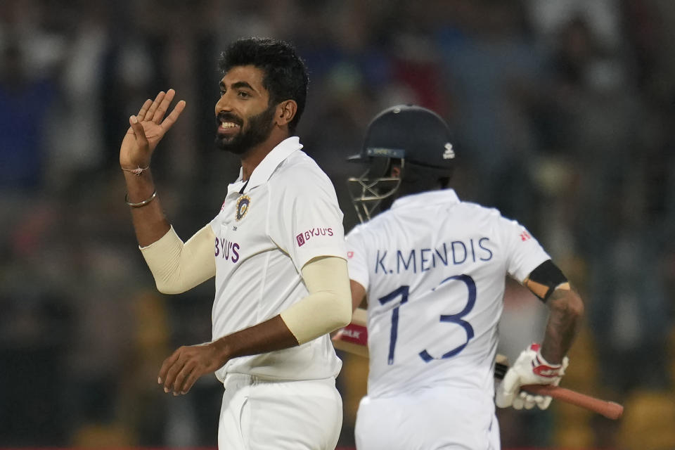 India's Jasprit Bumrah, left, reacts after bowling a delivery to Sri Lanka's Kusal Mendis, right, during the second day of the second cricket test match between India and Sri Lanka in Bengaluru, India, Sunday, March 13, 2022. (AP Photo/Aijaz Rahi)