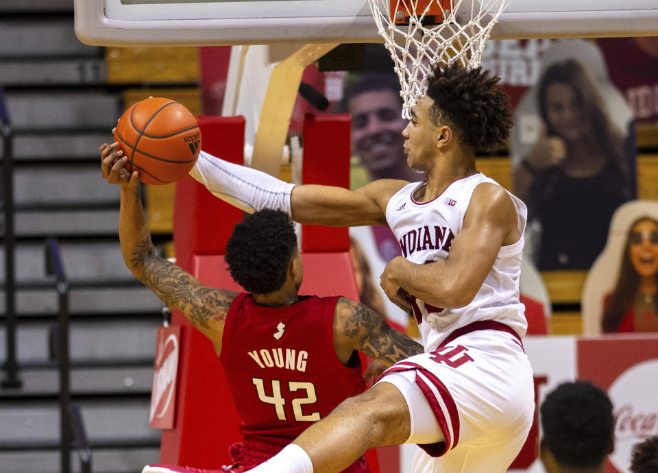 Indiana forward Trayce Jackson-Davis (23) blocks a shot by Rutgers guard Jacob Young (42) during the second half of an NCAA college basketball game, Sunday, Jan. 24, 2021, in Bloomington, Ind. (AP Photo/Doug McSchooler)