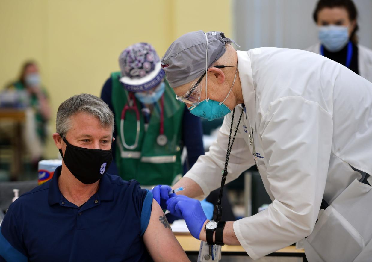 Worcester Police Chief Steven M. Sargent is vaccinated by city Medical Director Dr. Michael P. Hirsh on Jan. 11, 2021.