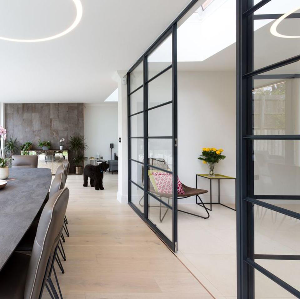 the steel framed double doors allows the homeowners of this house in mill hill