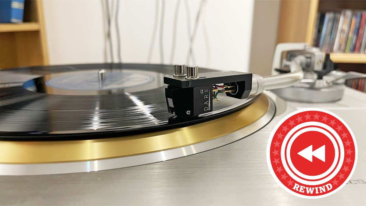  Rewind logo over a turntable. 