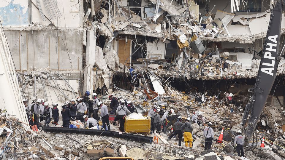 Search and rescue teams look for possible survivors and remains in the partially collapsed Champlain Towers South condo building on June 30, 2021 in Surfside, Florida. - Michael Reaves/Getty Images