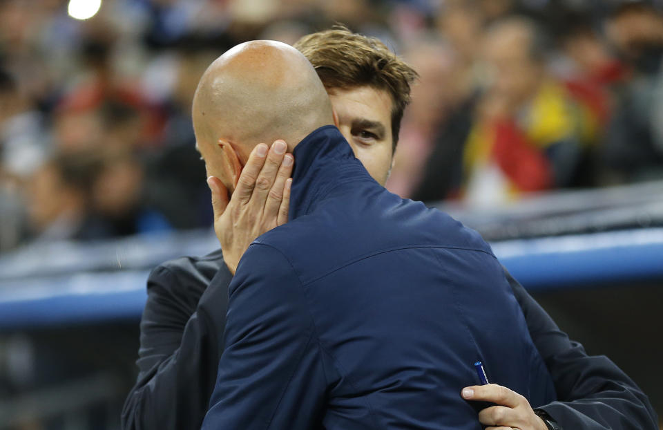 Tottenham coach Mauricio Pochettino, right, embraces Real Madrid coach Zinedine Zidane