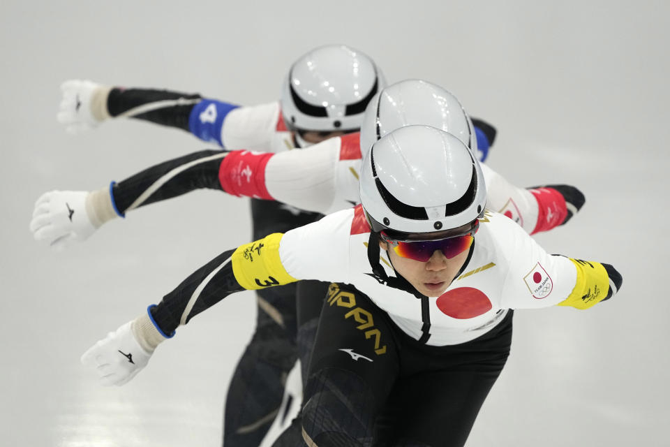 Team Japan, led by Miho Takagi, with Ayano Sato center and Nana Takagi, competes during the speedskating women's team pursuit semifinals at the 2022 Winter Olympics, Tuesday, Feb. 15, 2022, in Beijing. (AP Photo/Ashley Landis)