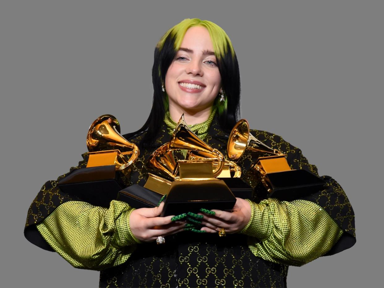 Billie Eilish, as singer-songwriter, poses in the press room with the awards for best album and best pop vocal album for "We All Fall Asleep, Where Do We Go?", best song and record for "Bad Guy" and best new artist at the 62nd annual Grammy Awards at the Staples Center, Los Angeles, graphic element on gray