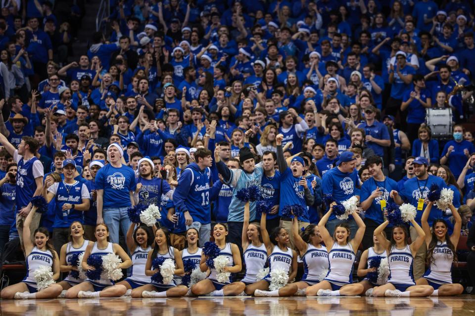 Dec 9, 2021; Newark, New Jersey, USA; Seton Hall Pirates fan cheer during the second half against the Texas Longhorns at Prudential Center. Mandatory Credit: Vincent Carchietta-USA TODAY Sports