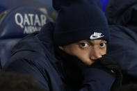 PSG's Kylian Mbappe sits on the bench during the French League One soccer match between Paris Saint-Germain and Lille at the Parc des Princes stadium in Paris, France, Saturday, Feb. 10, 2024. (AP Photo/Thibault Camus)