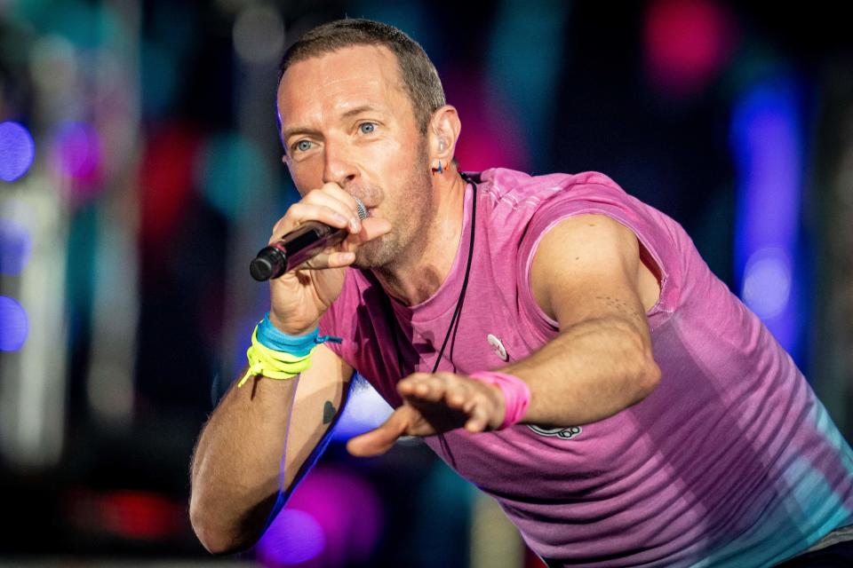 British singer Chris Martin of British band Coldplay performs at Parken Stadium in Copenhagen, on July 5, 2023. The concert is part of the Music of the Spheres World Tour. (Photo by Mads Claus Rasmussen / Ritzau Scanpix / AFP) / Denmark OUT (Photo by MADS CLAUS RASMUSSEN/Ritzau Scanpix/AFP via Getty Images)