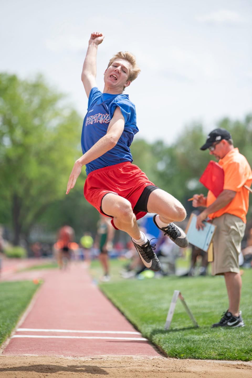 Swallows Charter Academy's Stephen Wietzke flys through the air during the Class 2A long jump finals at the state track and field meet on Thursday, May 19, 2022 at Jeffco Stadium.