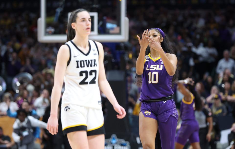 LSU forward Angel Reese (10) gestures towards Iowa guard Caitlin Clark (22) during the women's national championship game at the American Airlines Center in 2023.
