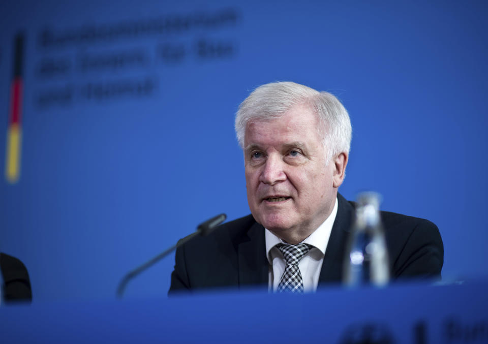 German Interior Minister Horst Seehofer speaks during a press conference in Berlin, Germany, Tuesday, June 18, 2019 on the killing of Walter Luebcke, a long-time member of Chancellor Angela Merkel's center-right Christian Democrats, who was found shot in the head on June 2 at his home near the central German city of Kassel, where he led a regional government office. (Bernd von Jutrczenka/dpa via AP)