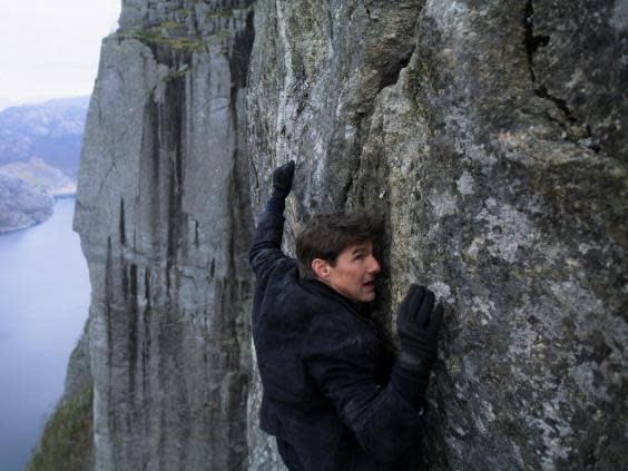 Ethan Hunt (Tom Cruise) clings to a cliff face in 2018’s ‘Mission: Impossible – Fallout’ (Paramount Pictures)