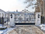 Every mansion needs an iron-barred gate to keep the riff raff out. (Zoocasa)