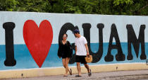 <p>Tourists stroll along a road on the island of Guam, a U.S. Pacific Territory, August 10, 2017. (Erik De Castro/Reuters) </p>