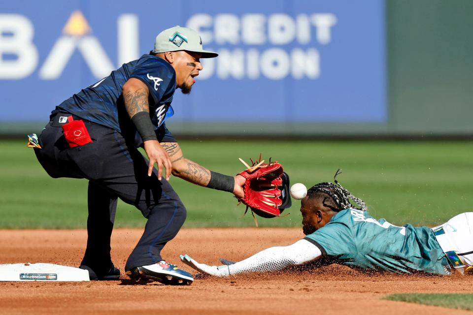 Shortstop Orlando Arcia tags out Randy Arozarena, who was attempting to steal.