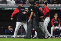 Cleveland Guardians manager Terry Francona, left, is restrained while arguing with home plate umpire Ron Kulpa after being ejected during the seventh inning of a baseball game against the Los Angeles Angels, Monday, Sept. 12, 2022, in Cleveland. The Guardians won 5-4. (AP Photo/David Dermer)