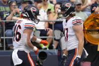Chicago Bears tight end Jake Tonges, left, celebrates with tight end Chase Allen, right, after Tonges scored a touchdown during the first half of a preseason NFL football game against the Seattle Seahawks, Thursday, Aug. 18, 2022, in Seattle. (AP Photo/Stephen Brashear)