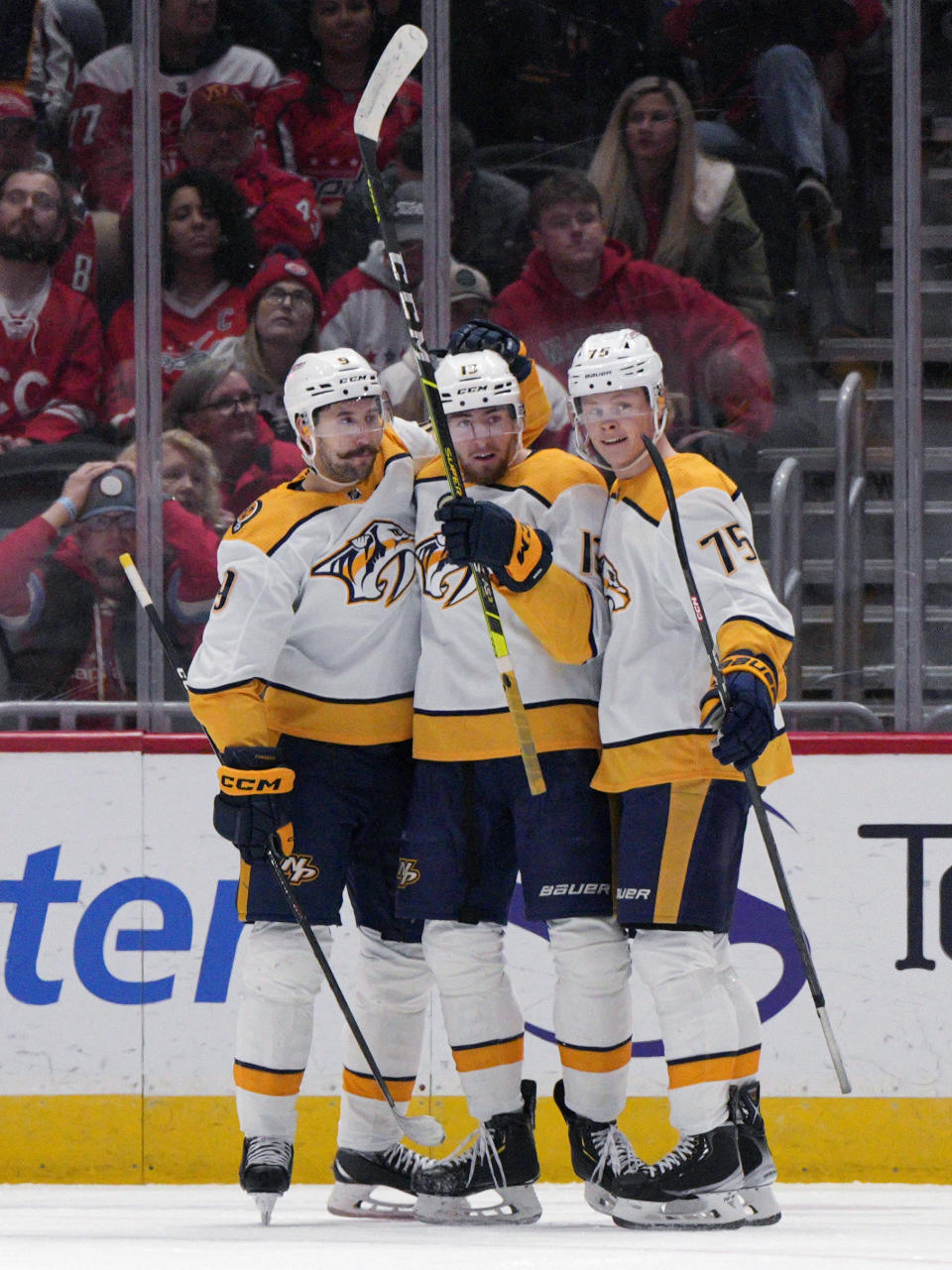 Nashville Predators center Yakov Trenin, center, celebrates with left wing Filip Forsberg, left, and center Juuso Parssinen after scoring against the Washington Capitals during the first period of an NHL hockey game Friday, Jan. 6, 2023, in Washington. (AP Photo/Jess Rapfogel)