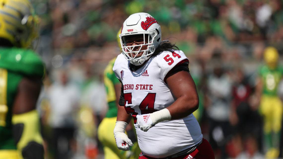 Fresno State offensive linesman Bula Schmidt (54) plays during the second half of an NCAA football game against Oregon on Saturday, Sept. 4, 2021, in Eugene, Ore. (AP Photo/Amanda Loman)